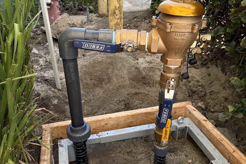 New backflow prevention assembly set on its concrete pad
