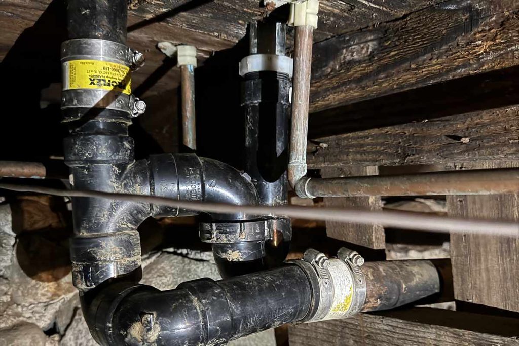 New drain lines run through the crawl space