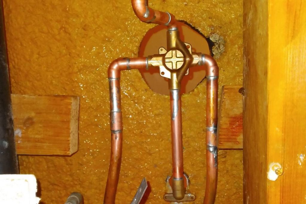 Copper shower valve rough-in set in the wall