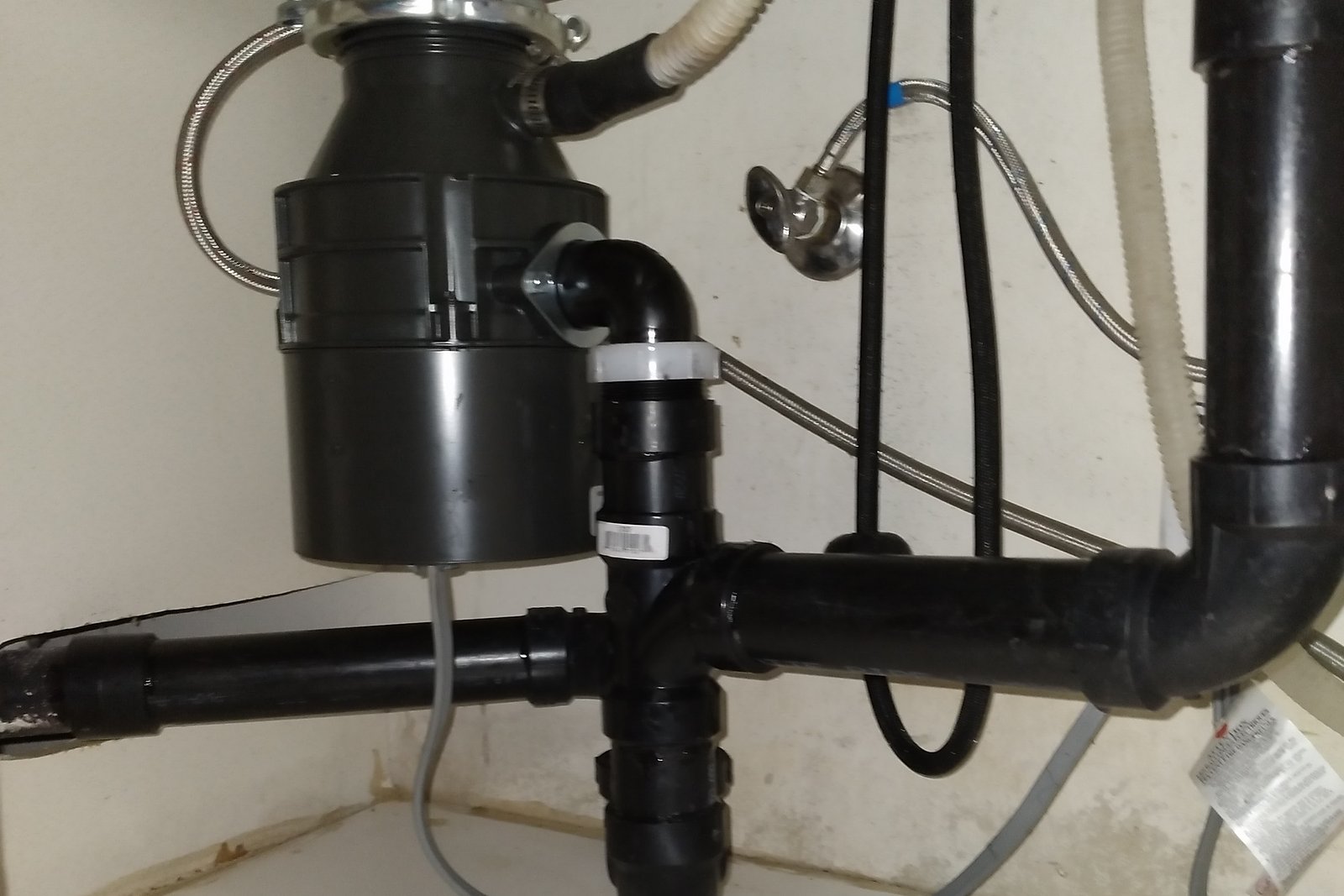 Garbage disposal and drain lines fitted under the sink
