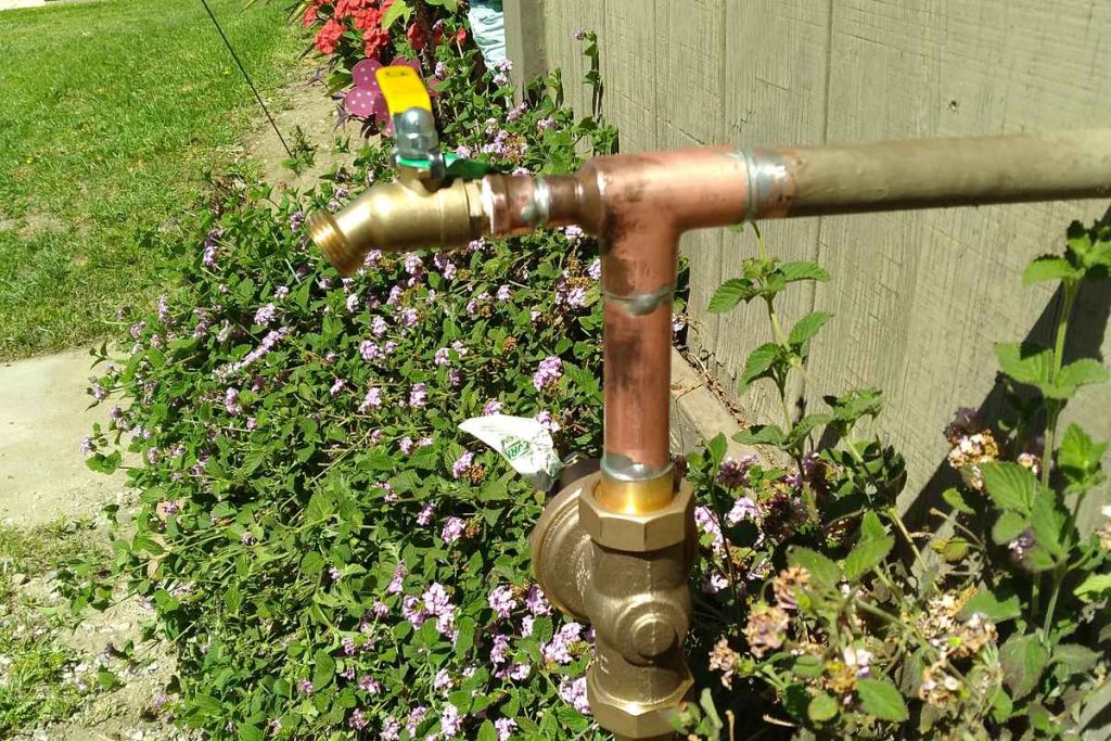 Brass main shut-off valve replaced in the garden