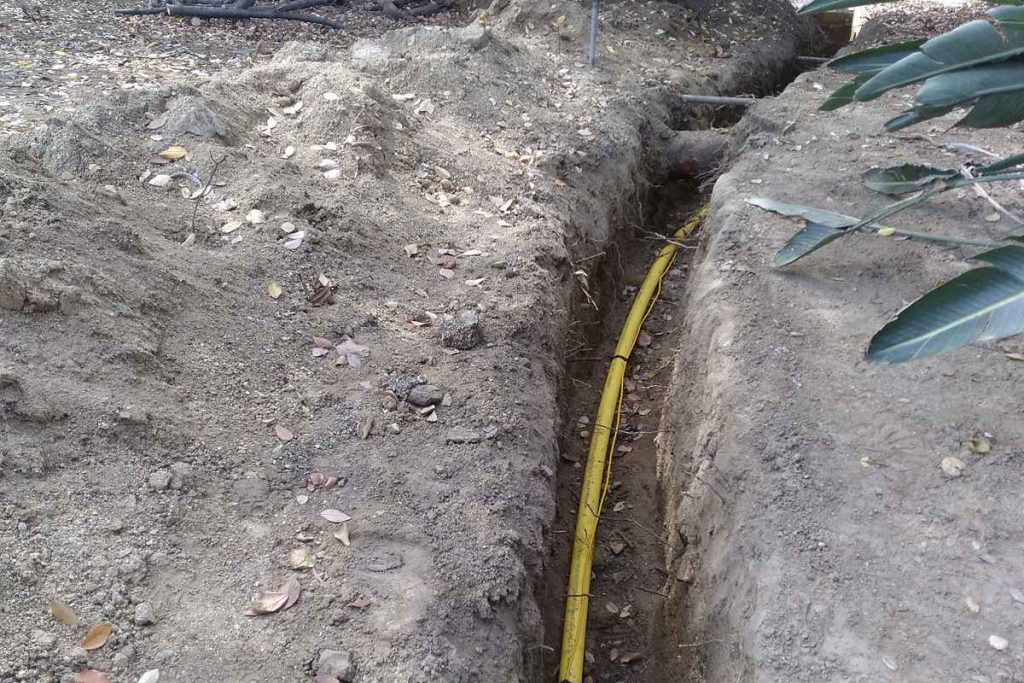 New yellow gas line laid in an open trench