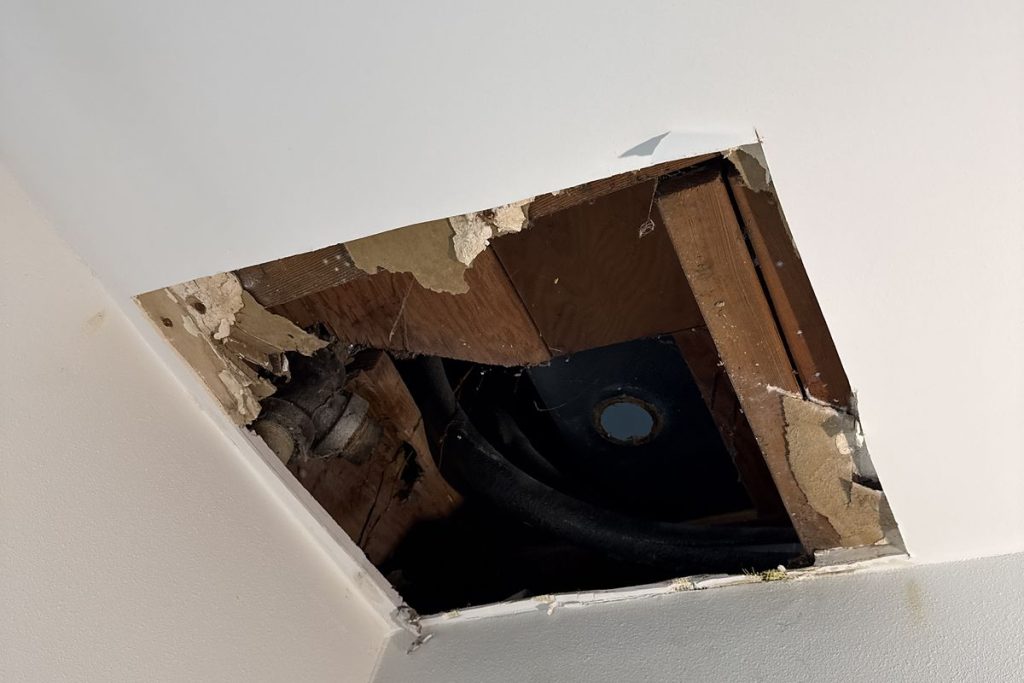 Ceiling opened to reach a leaking drain line