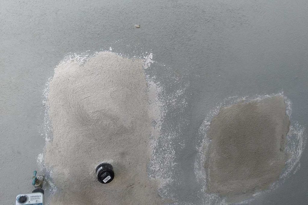 Stucco patched after an exterior pipe repair