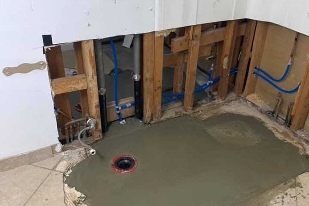Bathroom slab patched around a new closet flange