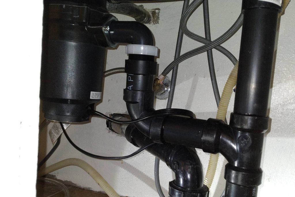 New disposal and drain assembly under a kitchen sink