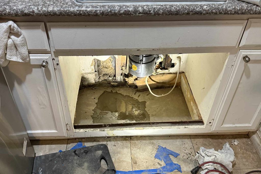 Kitchen floor opened under the sink for a slab repair