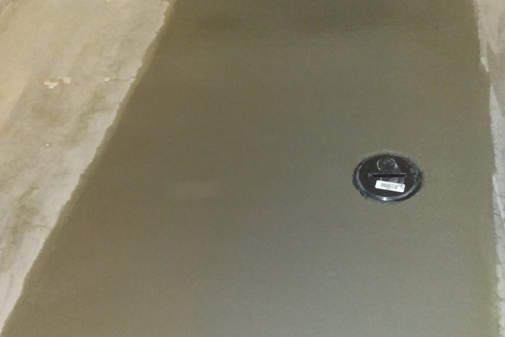Concrete patch with the cleanout set to grade