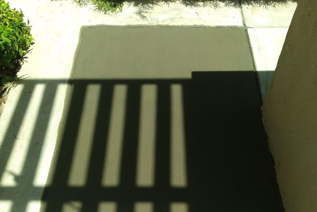 Side yard concrete patched after a sewer line repair
