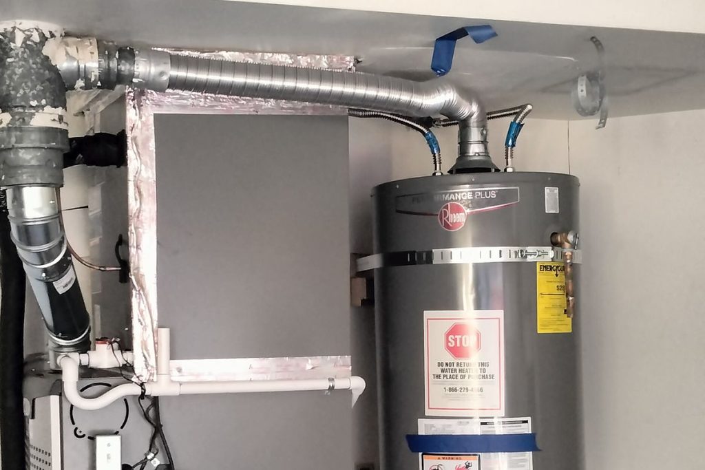 Water heater and furnace in a garage utility closet