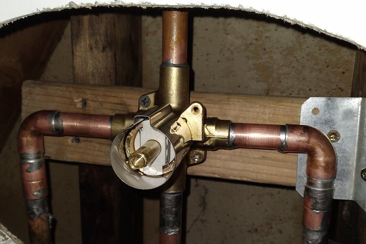 Shower valve replaced through a round wall access