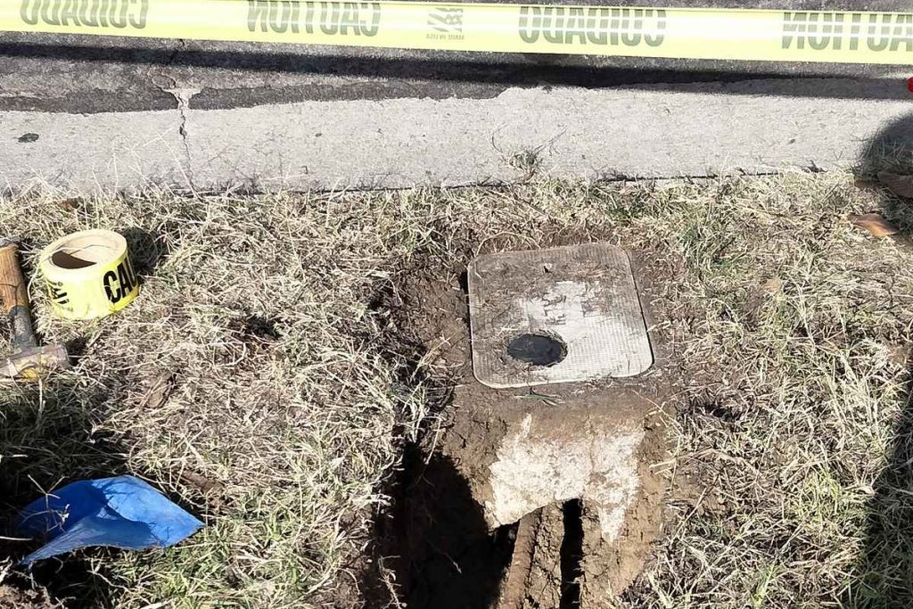 Sewer excavation at the parkway behind caution tape