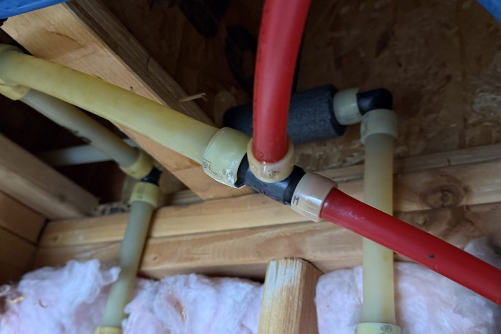 Hot and cold PEX lines run during a whole-house repipe