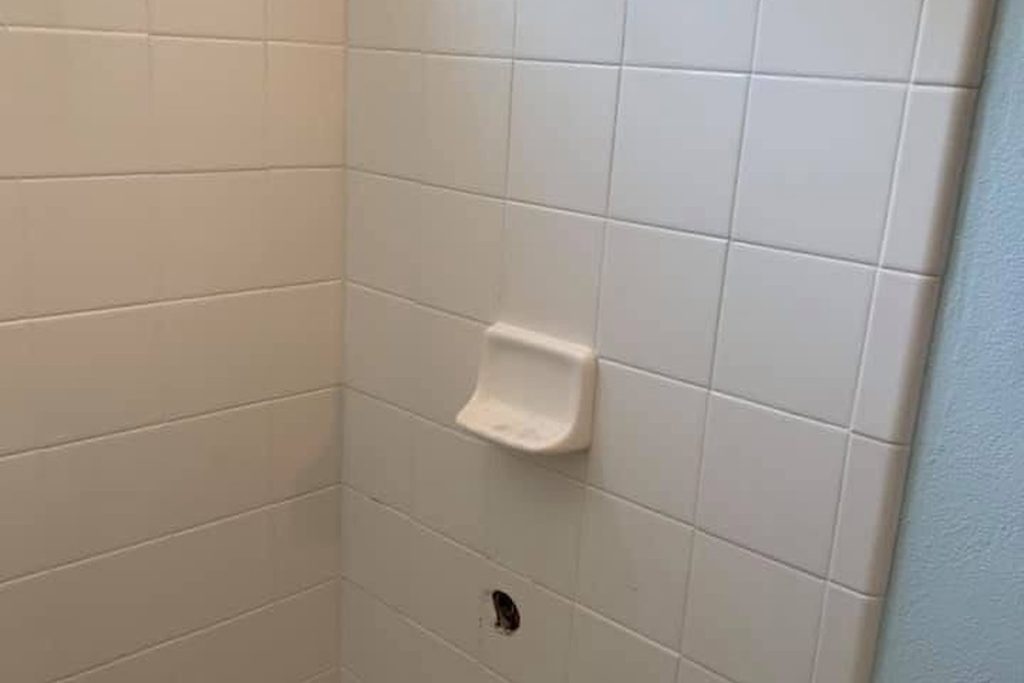 Tiled shower prepared for a new valve and trim