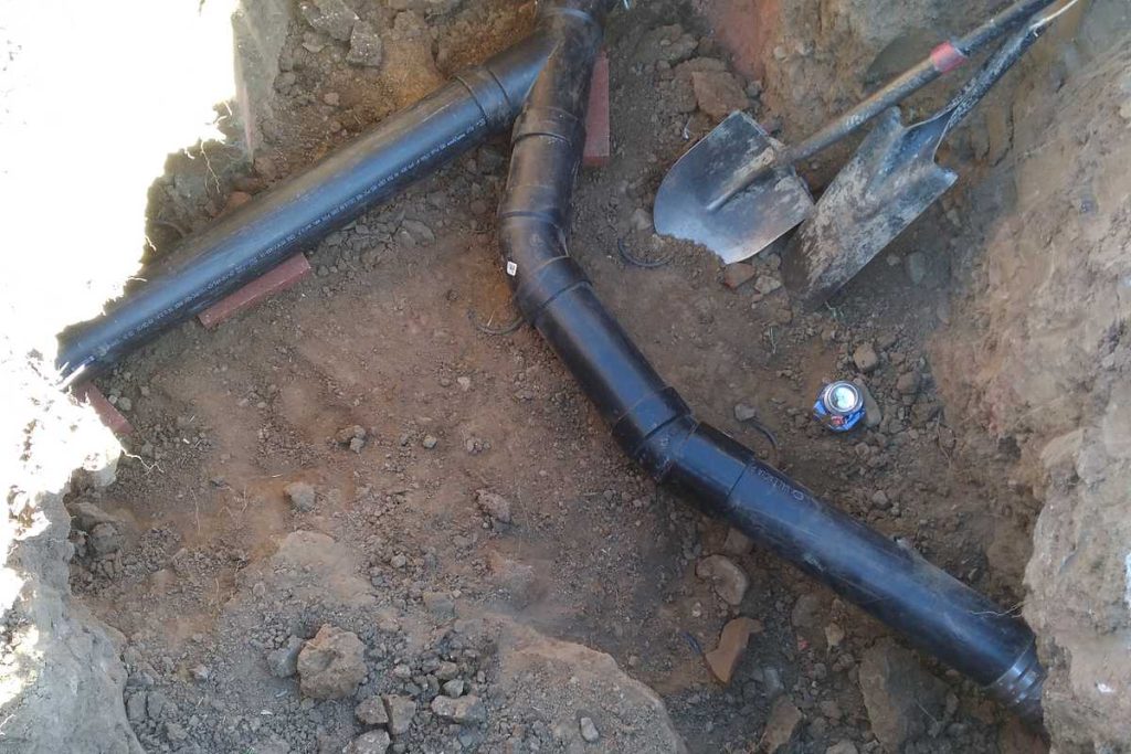 New sewer wye fitting set in an open excavation