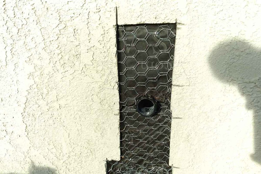 New cleanout brought through a stucco wall