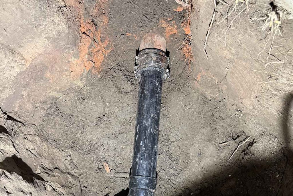 New sewer pipe fed into an open excavation