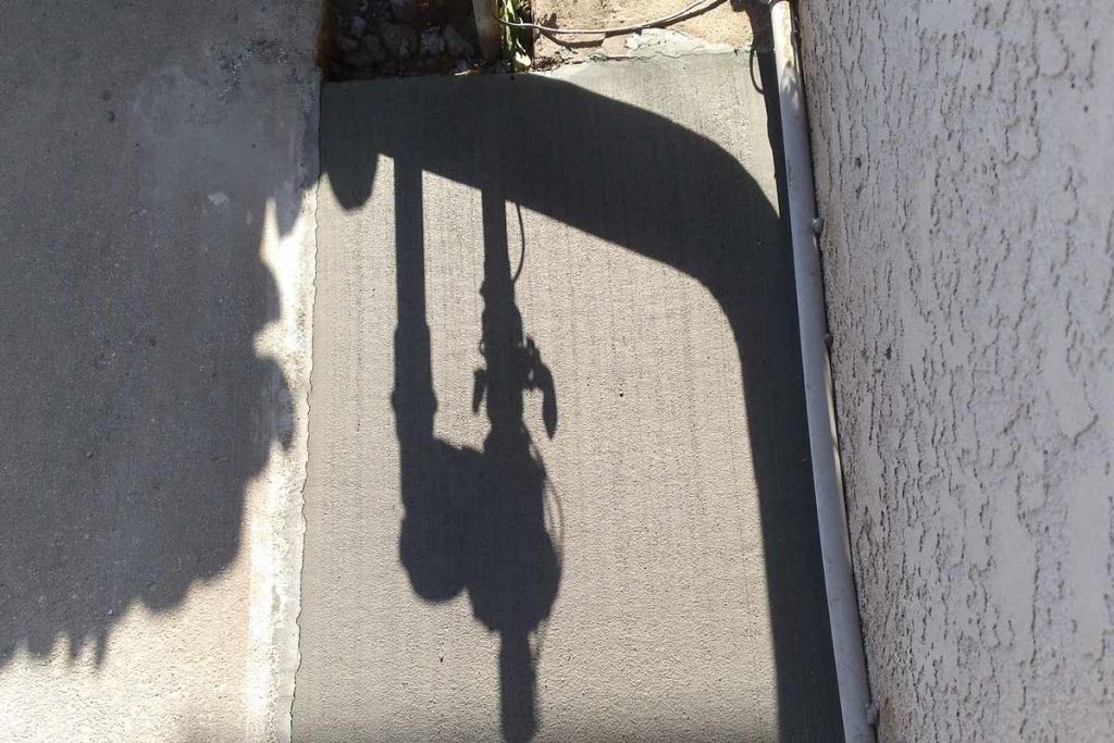 Concrete patch completed along an exterior wall