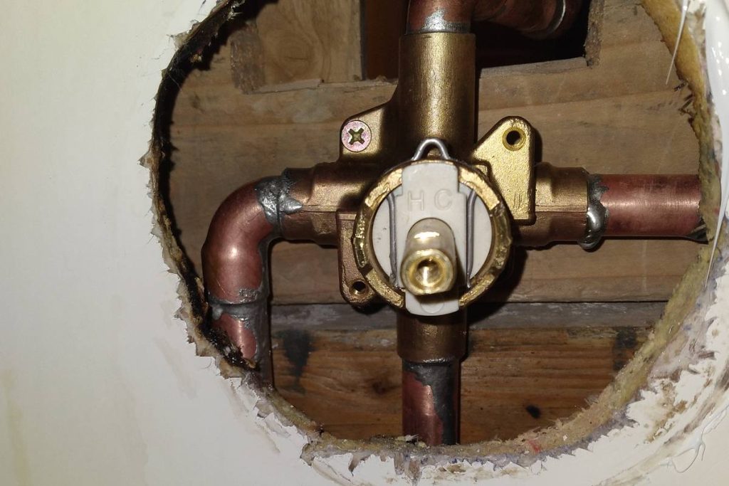 New shower valve fitted through the wall opening