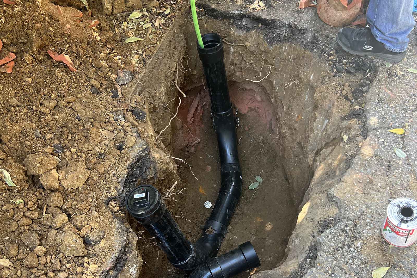 New sewer cleanout assembly set in an excavation