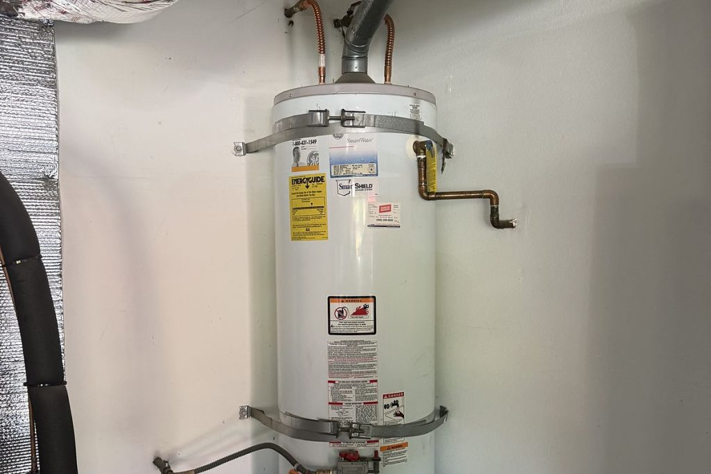 Water heater with new flex connectors in a closet