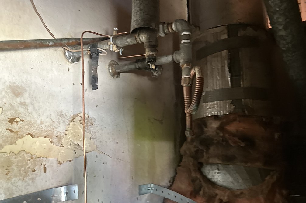 Water heater flue and vent connector during a service call