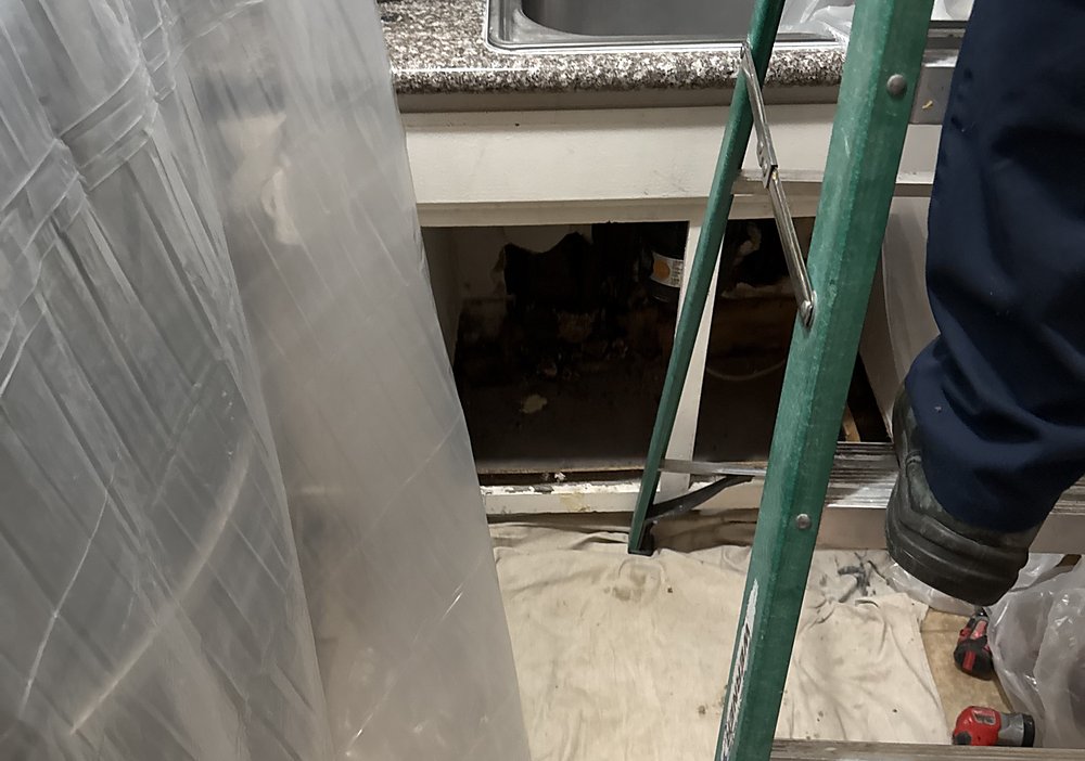 Kitchen protected with containment during a repipe