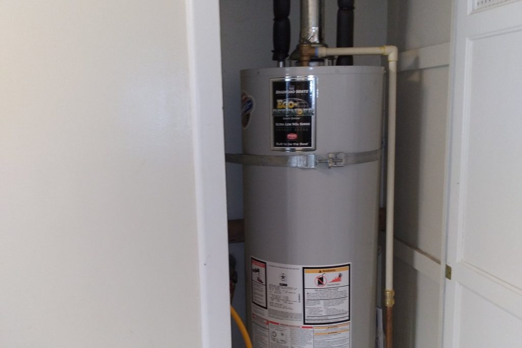 Water heater installed inside a closet enclosure