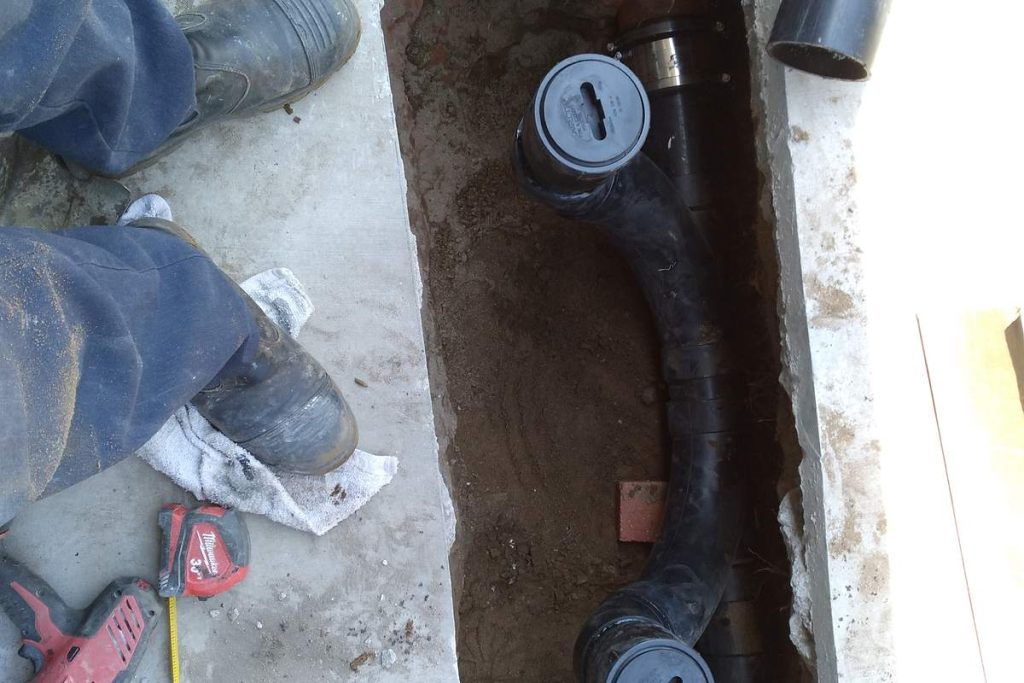 New cleanouts and backwater valve set in the trench